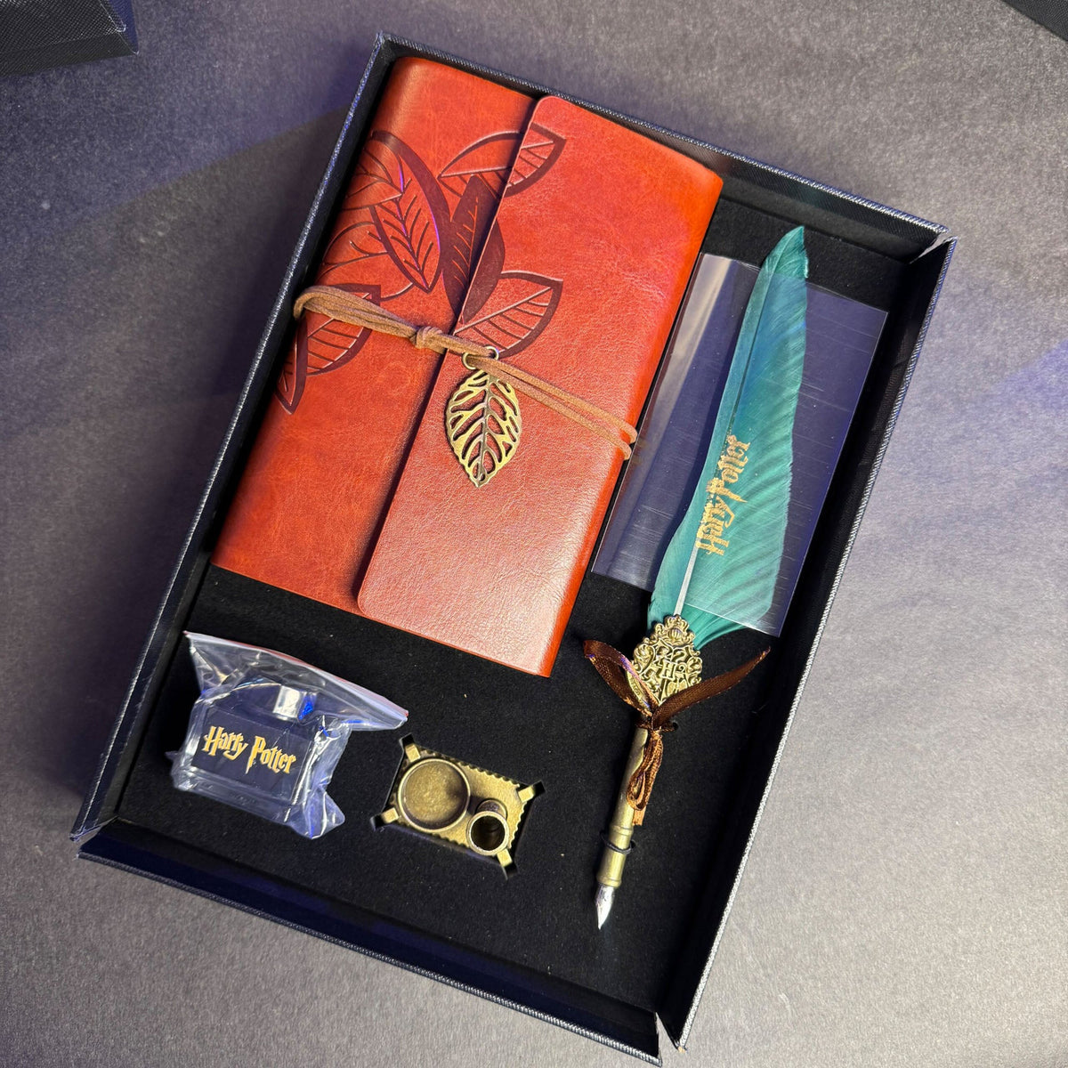 Harry Potter calligraphy set features a green feather quill pen