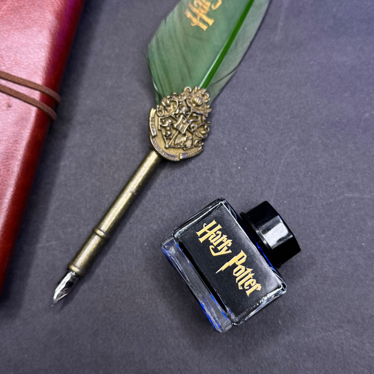 Harry Potter calligraphy set features a green feather quill pen